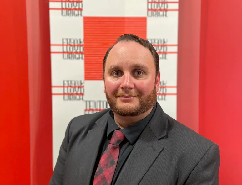 Professional portrait in front of banner